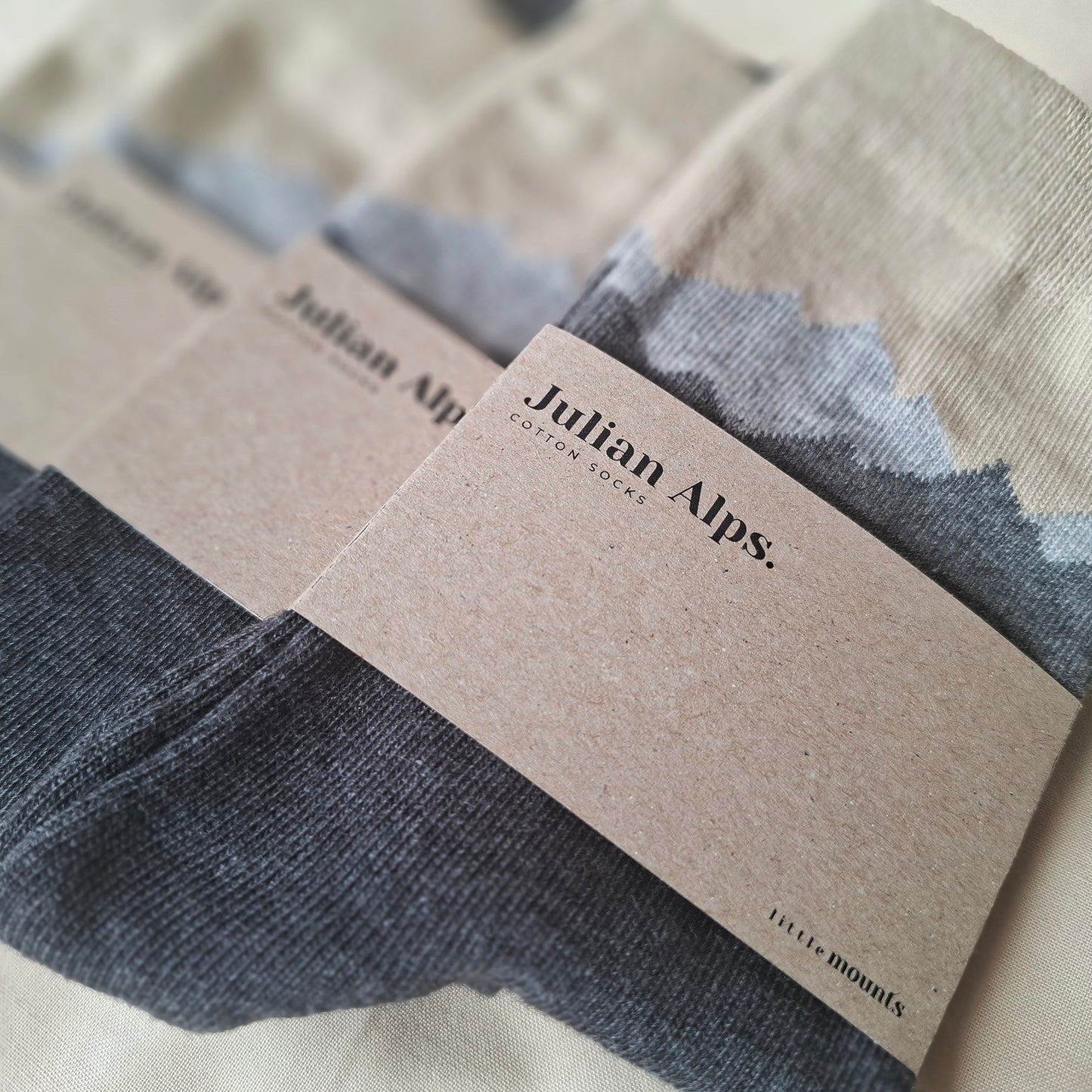 Pair of casual cotton socks with 'Julian Alps' branding on a neutral background.